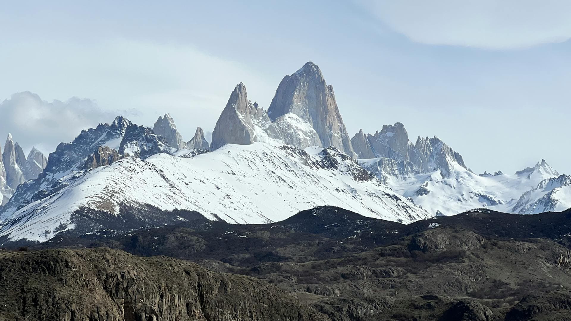 The dramatic snow-capped granite peaks of Mount Fitz Roy in Argentine Patagonia under a clear blue sky