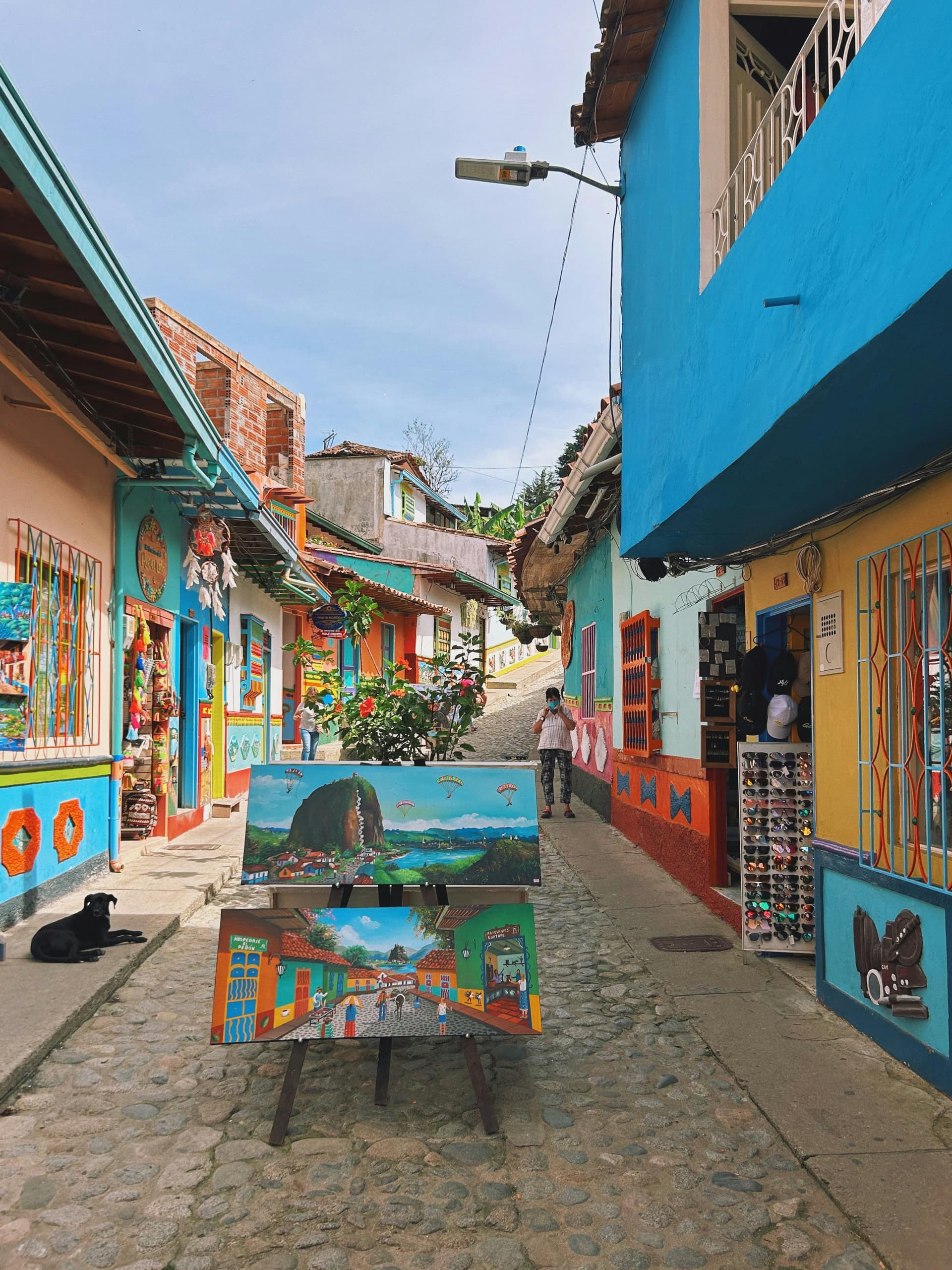 Vibrant alleyway in Peñol, Antioquia, Colombia with colorful houses and street art